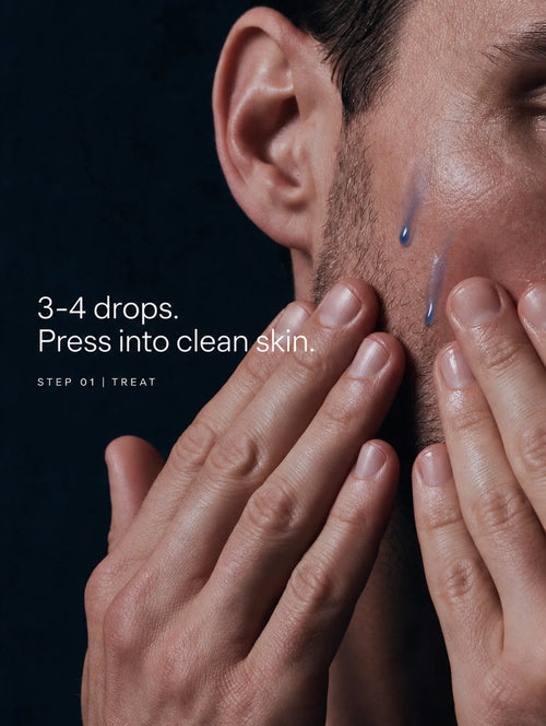 Man pressing three to four drops of GHK-Cu copper peptide serum into his cheek