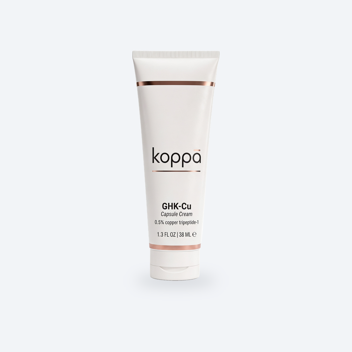 Koppā GHK-Cu Capsule Cream tube on a soft porcelain background