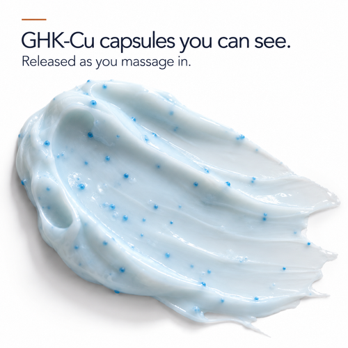 Swatch of the GHK-Cu moisturizer with visible blue copper peptide capsules suspended in white cream
