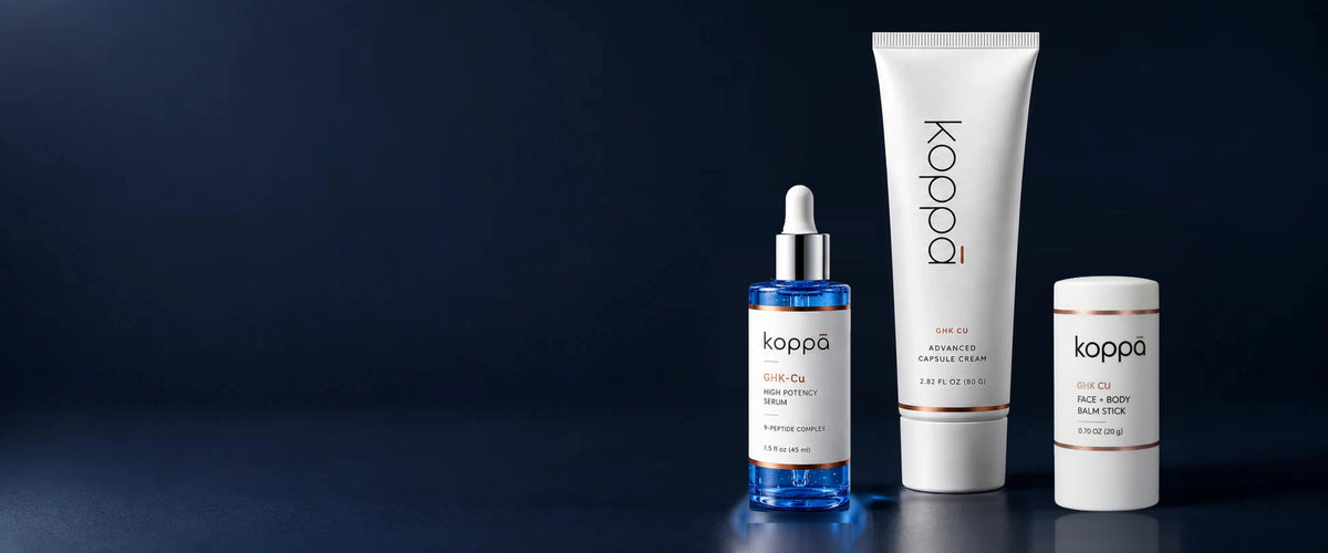 Koppā copper peptide serum, capsule cream and balm stick on a navy background