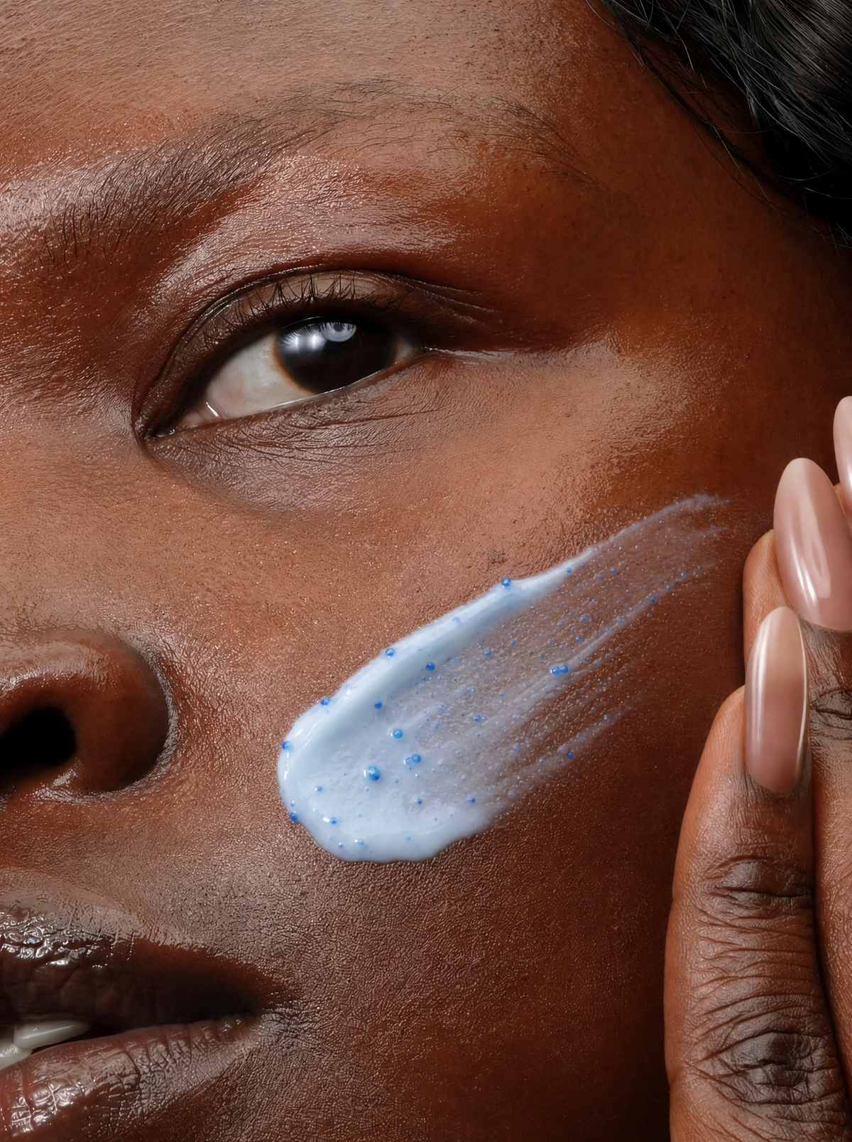 Koppā capsule cream swatched across a woman's cheek
