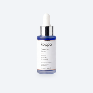 Koppā GHK-Cu 2% Serum dropper bottle on a soft porcelain background
