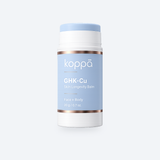Koppā GHK-Cu Skin Longevity Balm stick on a soft porcelain background