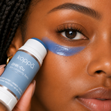 Woman applying Koppā GHK-Cu stick under her eye — copper peptides skincare