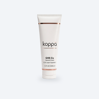 Koppā GHK-Cu Capsule Cream tube on a soft porcelain background
