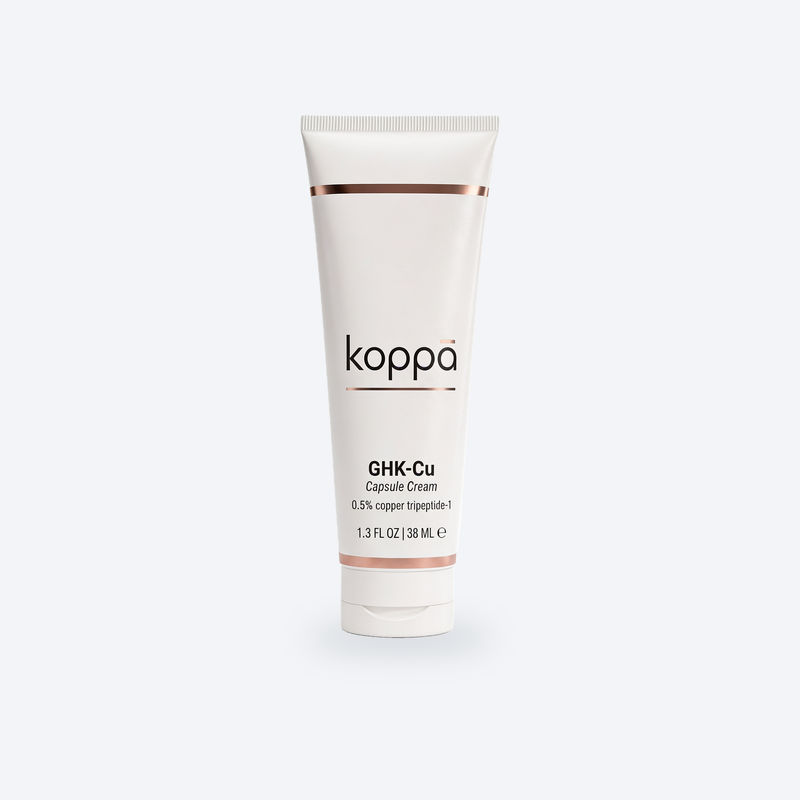 Koppā GHK-Cu Capsule Cream tube on a soft porcelain background