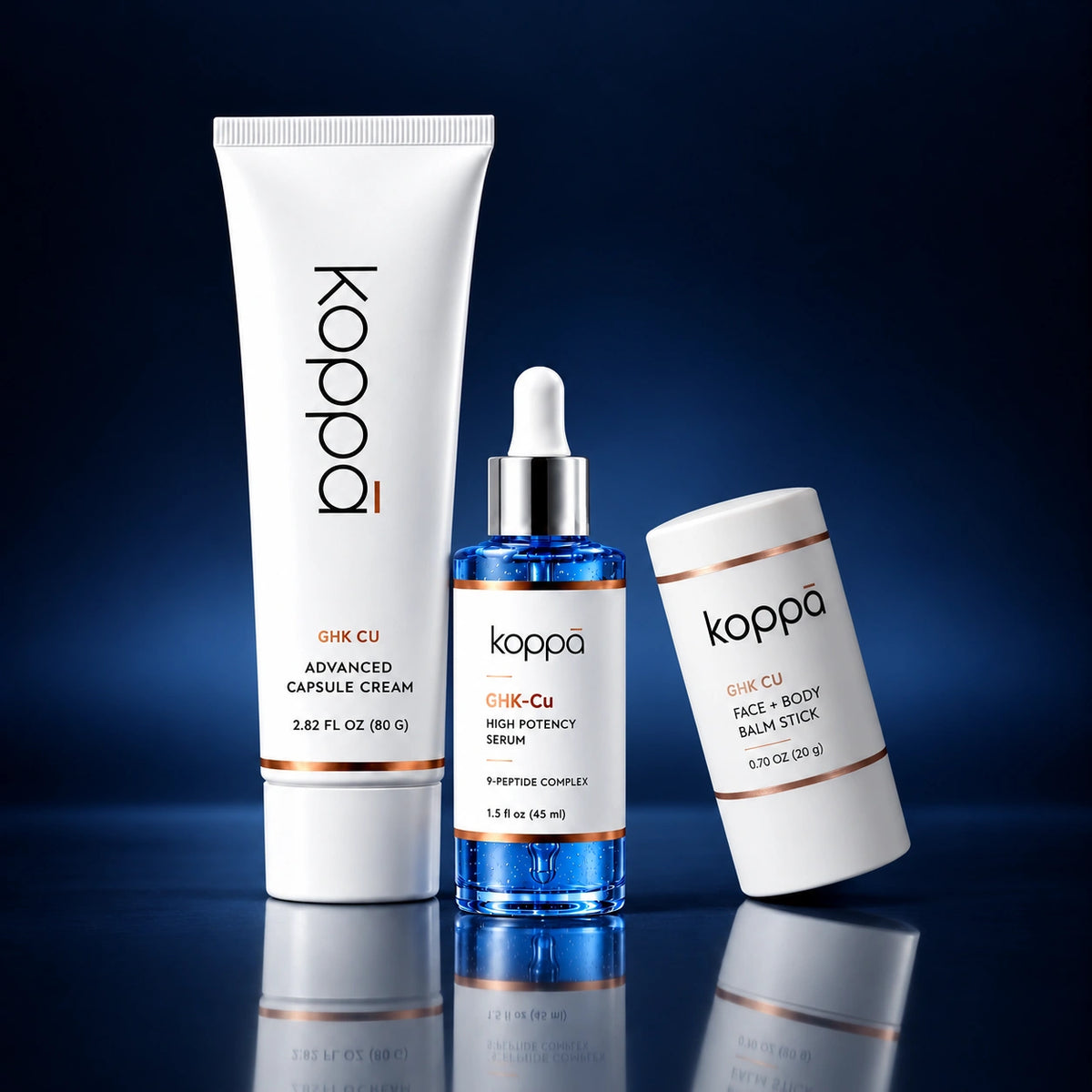 The Koppā serum, capsule cream and balm stick on a dark studio background